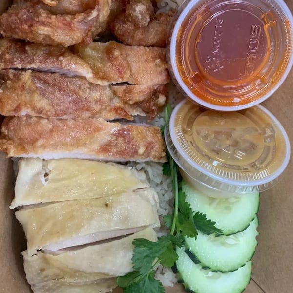 Thai fried and steamed chicken with rice, cucumbers, cilantro, and two dipping sauces.